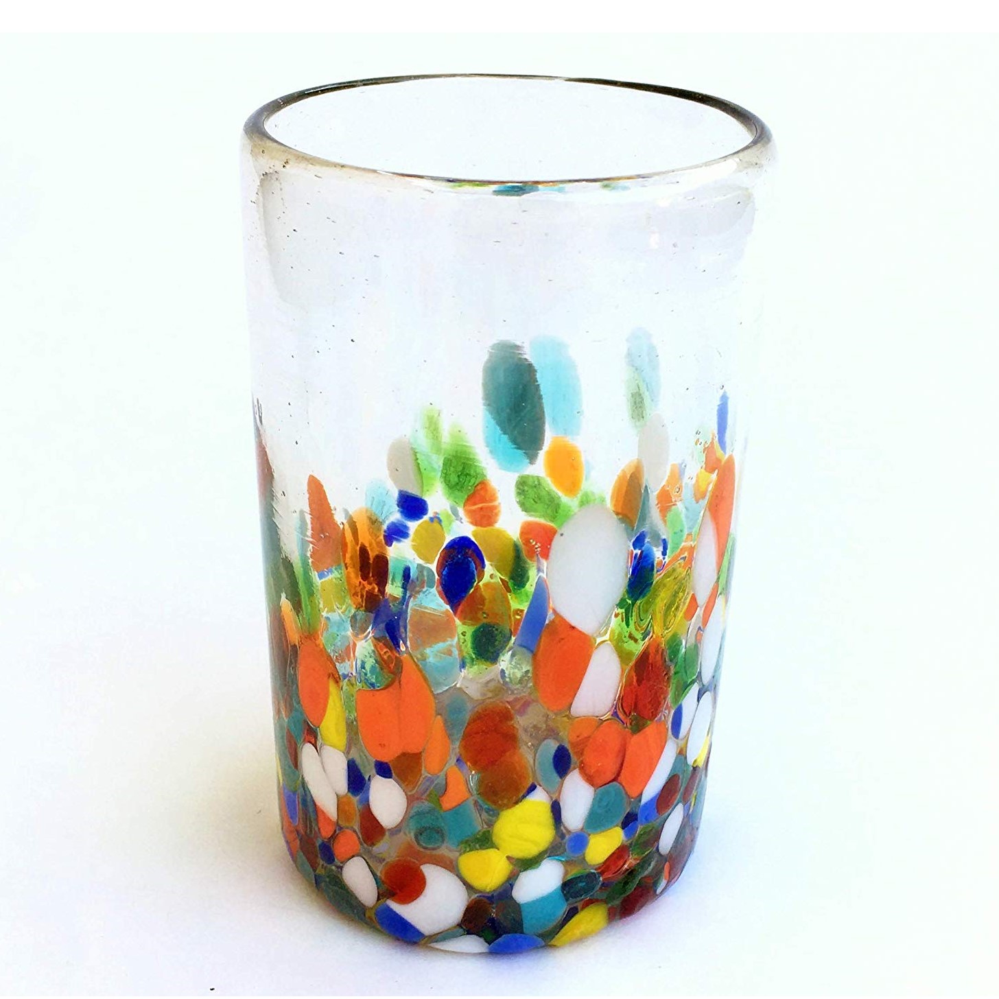 Sale Items / Clear & Confetti 14 oz Drinking Glasses (set of 6) / Our Clear & Confetti drinking glasses combine the best of two worlds: clear, thick, sturdy handcrafted glass on top, meets the colorful, festive, confetti bottom! These glasses will sure be a standout in any table setting or as a fabulous gift for your loved ones. Crafted one by one by skilled artisans in Tonala, Mexico, each glass is different from the next making them unique works of art. You'll be amazed at how they make having a simple glass of water a happier experience. Each glass holds approximately 14 oz of liquid and stands a bit over 5